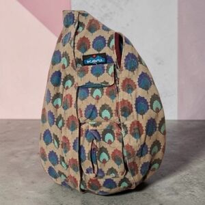 Kavu Multicolor Patterned Sling Backpack with Teal, Blue, Burgundy Accents